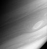 Gaseous Saturn rotates quickly -- once every approximately 10.8 hours -- 
and its horizontal cloud bands rotate at different rates relative to each 
other