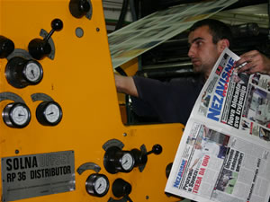 A technician adjusts colors on daily Nezavisne Novine. Circulation has grown, and the paper needs two print runs to produce 15,000 copies daily.