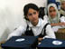 A student from the Hala Bint Khuwaylid secondary girl's school in the Amil district of Baghdad with her new school bag which contains, pens, pencils, notebooks, a calculator and other school supplies. USAID is funding the purchase and distribution of 1.5 million of the bags through a contract with Creative Associates International. All Iraqi secondary students will receive the bags.