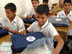 Students from the Zein Al Abdeen secondary boy's school in the Amil district of Baghdad with their new school bags which contains, pens, pencils, notebooks, a calculator and other school supplies. USAID is funding the purchase and distribution of 1.5 million of the bags through a contract with Creative Associates International. All Iraqi secondary students will receive the bags. 