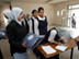 Students from the Hala Bint Khuwaylid secondary girl's school in the Amil district of Baghdad sign for and receive school bags which contain, pens, pencils, notebooks, a calculator and other school supplies. USAID is funding the purchase and distribution of 1.5 million of the bags through a contract with Creative Associates Internaitonal. All Iraqi secondary students will receive the bags.