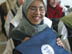 A student from the Hala Bint Khuwaylid secondary girl's school in the Amil district of Baghdad with her new school bag which contains, pens, pencils, notebooks, a calculator and other school supplies. USAID is funding the purchase and distribution of 1.5 million of the bags through a contract with Creative Associates International. All Iraqi secondary students will receive the bags.