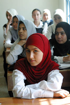 A student from the Hala Bint Khuwaylid secondary girl's school in the Amil district of Baghdad attends a class in the refurbished scdhool. USAID funded the renovation of 1260 schools throughout Iraq in time for the start of school in October 2003.