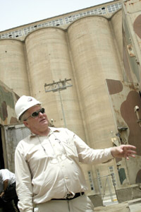 An engineer oversees the startup of generators in Umm Qasr, Iraq