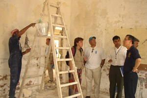 Representatives of USAID's Office of Transition Initiatives and the International Organization for Migration brief U.N. Under-Secretary-General for Humanitarian Affairs and Emergency Relief Coordinator to Jordan, Iraq and Kuwait about the U.S.-funded rehabilitation of a secondary school during a recent tour of the facility in Umm Qasr.