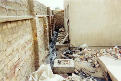 Debris and building waste in the school yard of the Al-Asseel boys school.