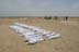 The remains of Iraqis from a mass grave in Musayib, 75 KM SW of Baghdad lie wrapped in white linen shrouds before being moved to a makeshift mougue. The victims are thought to be from  among some 2,000 persons reported missing after the 1991 uprising against the Iraqi government.