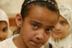 An Iraqi school girl in class at the Agadir Secondary school in the Saydiya neighborhood of Baghdad. Several rooms of the school were looted during the war. USAID is looking at refurbishing the school.