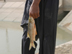 A fisherman holds a fish trapped netted in the Sweet Water Canal project that supplies all the fresh water to the city of Basrah and environs. The reservoirs must be drained before the accumulated silt can be removed. The serpentine walls within the reservoir are designed to slow the flow of water allowing solids to settle  providing cleaner water to water treatment  plants downstream. The 275km canal, storage reservoir and pumping stations have suffered from a lack of maintenance and will be rehabilitated by USAID partner Bechtel at a cost of almost $12 milllion. When completed by March 1, 2004 it will serve 1.75 million citizens of the Basrah region.