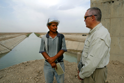 A senior Civil Engineer of the US Army Corps of Engineers and an Iraqi Site Engineer inspect ongoing work at the Sweet Water Canal project. Since 1996 the canal has supplied all the fresh water to the city of Basrah and environs. The 275km canal, storage reservoir and pumping stations have suffered from a lack of maintenance and will be rehabilitated by USAID partner Bechtel at a cost of almost $12 milllion. When completed by March 1, 2004 it will serve 1.75 million citizens of the Basrah region.