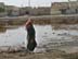 An extremely high water table, the lack of any drainage systems and the open-air sewage canals create stagnant pools near a residential area of Nasiriyah in southern Iraq. Distribution of potable water remains a big problem for the citizens.  Existing water lines are few and are often contaminated because of a high water table and the presence of open sewage. USAID partner RTI is finding solutions for the aging, poorly maintained water and wastewater infrastructures.