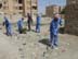 Cleanup crews collect garbage in a residential neighborhood of Nasiriyah in southern Iraq. USAID partner RTI works with Iraqi laborers to organize regular trash collection.