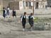 In a residential neighborhood of Nasiriyah in southern Iraq, children return from school past raw sewage and garbage.  The lack of drainage systems, a high water table and the open-air sewage canals have created health issues. USAID partner RTI is working to organize regular trash collection and to address poorly maintained water and wastewater infrastructures.