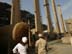 Engineers make a site inspection at the Baghdad South power plant. USAID is funding the repair of Iraq's nationwide electrical system, which consist of some 29 major generating plants, transmission grids and local substations.  Baghdad South, like many other power facilities, is in great disrepair.