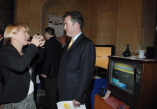 NTIA Assistant Secretary John Kneuer (right) with analog TV at the Digital Television Expo.  Click here for larger image.