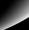 This view of high southern latitudes on Saturn shows very linear clouds at 
top, usually indicative of stable prevailing winds, and two turbulent, 
swirling features farther south