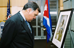 Secretary Mel Martinez observing the exhibit