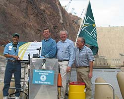 Photograph of Former EPA Administer Mike Leavitt presenting a Certificate of Recognition to representatives of Black Canyon Willow Beach River Adventures.