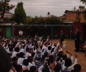Presidential Management Fellow Paul Neville takes questions on American culture at Lalitpur Secondary Boarding School in Nepal. [State Dept. Photo]