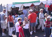 Visitors crowd the United States Geological Survey booth at the Shark Festival and Sanctuary Celebration on the Santa Cruz Wharf