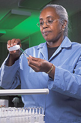 Chemist prepares water samples for nutrient analysis: Click here for full photo caption.