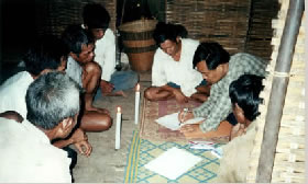 Photo of the LAC lawyer prepares document for indigenous land reclamation