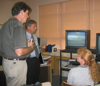 Abby Sallenger and Karen Morgan compare before-and-after-Hurricane-Katrina video footage from the Chandeleur Islands, Louisiana, with news reporter Steve Nicholson