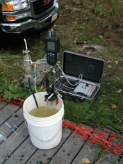 A flow-through chamber is used to measure redox conditions (pH, Eh, temperature, …) in ground water being pumped from a well in a naturally biodegrading plume of chloroethenes, Soldotna, AK