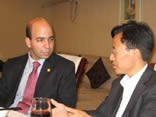 Photo of former EPA General Counsel Roger Martella (left)  
    and Bie Tao, Deputy Director of MEP's Policy and Law Department