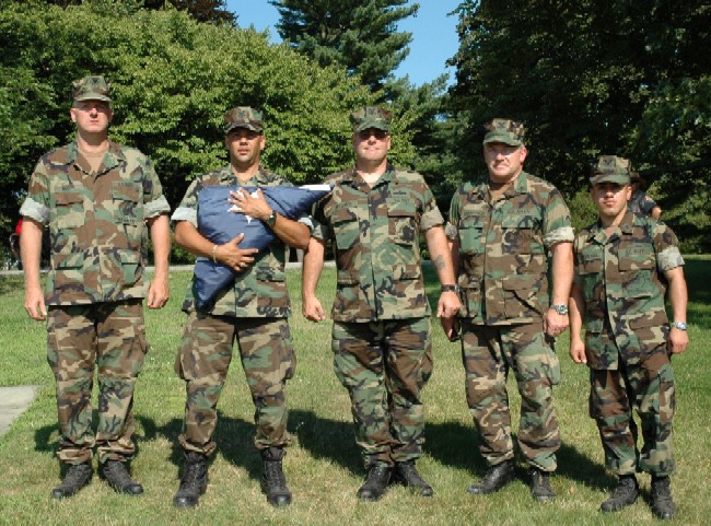 Members of the Navy's Construction Battalion 21 from Ft. Schuyler pose after participating in a flag folding ceremony at Sagamore Hill.