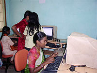 Young girls practice computer skills at the local computer center. Photo USAID/Nina Minka