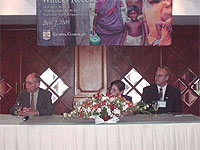 USAID/Sri Lanka Mission Director Carol Becker (center) and team leader Ben Kauffeld (right) at the head table of the Geneva Global bidder’s conference in Colombo. At left is US Ambassador to Sri Lanka Jeffrey Lunstead. Photo: USAID/Ivan Rasiah