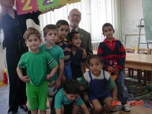 Goldman with children at an orphanage in Skopje, Macedonia