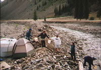 Filling a holding tank with a tracer solution prior to the start of a stream tracer study, Upper Animas River Watershed, CO