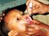 Photo of a young boy receiving two drops of oral polio vaccine during Ethiopia’s 1999 NIDs.