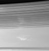 The soft, sweeping shadows of Saturn's C ring cover bright patches of 
clouds in the planet's atmosphere. The shadow-throwing rings stretch 
across the view at bottom. The dark inner edge of the B ring is visible 
at top
