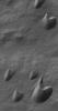 This MOC image shows dark sand dunes, with a thin coating of autumn frost, in the Ogygis Regio west of Argyre basin