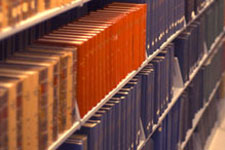 References books on a shelf.