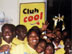 Photo of several people dancing and smiling at Club Cool in Haiti.