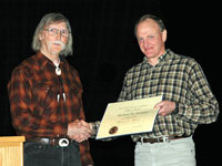 Dirk Derksen presents a DOI Meritorious Service Award to R. Mike Anthony