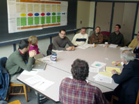 Herman Karl (in white sweater) meets with MIT graduate students and some of the interested parties in the Nantucket wind-farm dispute to discuss the use of joint-fact-finding procedures.