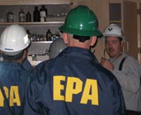 EPA workers inspect a school lab.