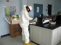An EPA worker inspects a school lab.