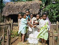 Photo of children standing around a clean water fountain.