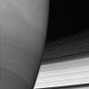 Saturn's B and C rings disappear behind the immense planet. Where they meet the limb, the rings appear to bend slightly owing to upper-atmospheric refraction