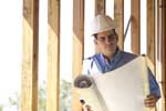 Photo of a man studying a project plan