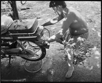 Photo: Ban Kunthy was a 17-year-old soldier fighting near the Thai border when he stepped on a landmine in 1985. He now lives outside of Phnom Pehn, Cambodia, with his wife and tow children. His prosthetic leg was provided by a USAID-funded rehabilitation center.