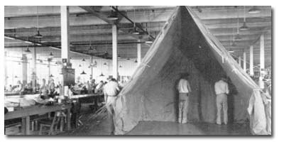 Federal inmates manufacture tents for the U.S. military, circa 1942