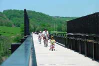Photo of a some people riding bicycles along part of the Great Allegheny Passage