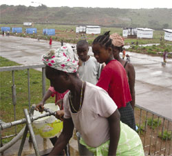 Photo: After helping assess water, sanitation, and health needs, the DART supplied one latrine per 100 displaced people in Liberia.